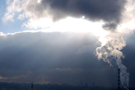 A sun through the smoke and cloudsの写真素材