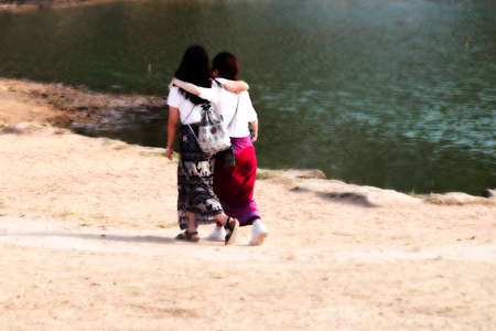 Two girls are good and hugging.の写真素材