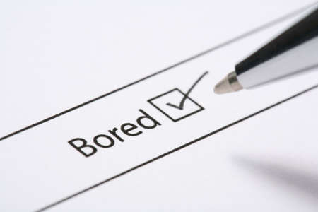 Form with a bored tick box and pen tick