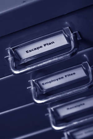 filing cabinet with a draw heading escape plan, time for a change.の写真素材