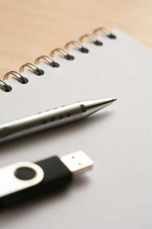 pen notepad and usb stickの写真素材