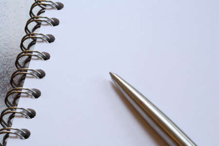 Pen and paper with ring bound notepadの写真素材