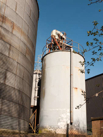 An amazing shot of some industrial buildings rising upの写真素材