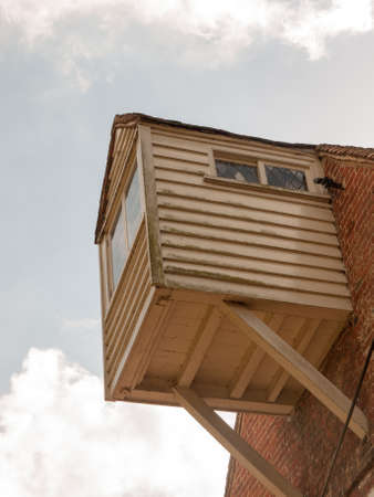 Old cottage box balcony made of wood and in the lovely day time lightの写真素材