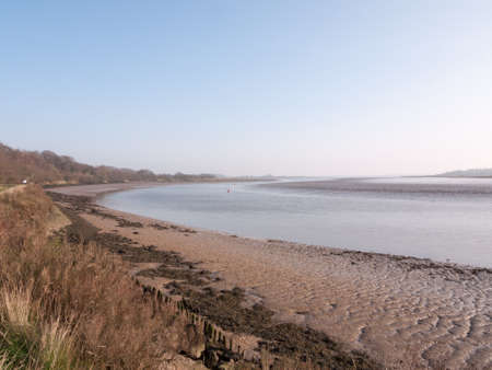 Various shots of the river and the mud, along with many birds, buoys, and other sea structures, as...