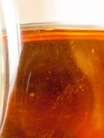 texture of a beer in a bottle from the side close upの写真素材