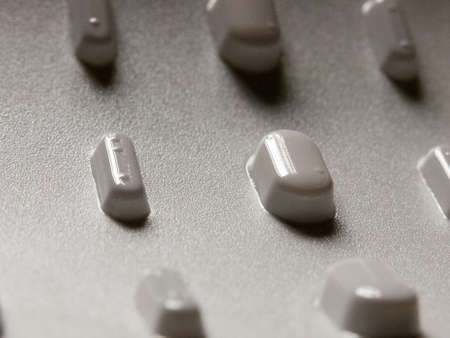 tablets in a packet upside down seen from bottom for illness relief studio