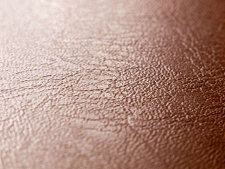 rough and smooth texture of brown leather up close studioの写真素材