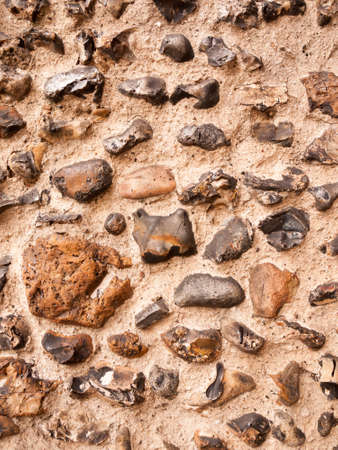 beautiful brick wall of cobble outside of church on cloudy dayの写真素材