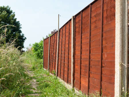 brown wooden backyard fence outsideの写真素材
