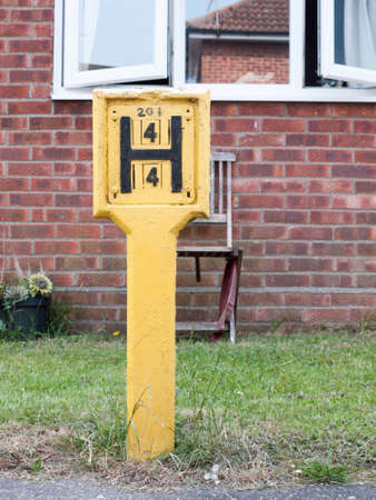 yellow h sign outside hydrant fire safetyの写真素材