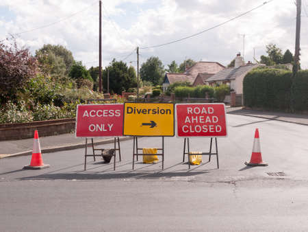 road works road blocked signs and traffic cones diversion access only; Essex; UKの写真素材