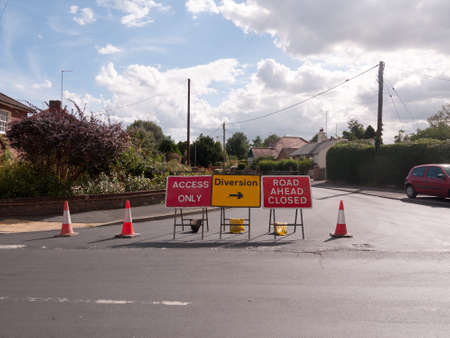 road works road blocked signs and traffic cones diversion access only; Essex; UKの写真素材