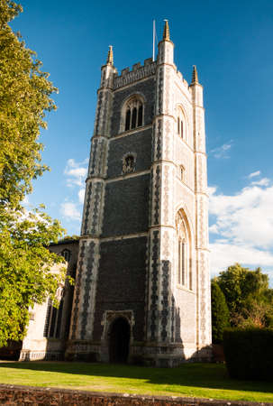 a view of dedham church in summer light with a beautiful blue clear sky; UKのeditorial素材