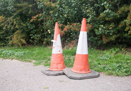 close up of two traffic cones on pavement; UKの写真素材