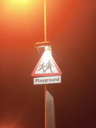 Street safety sign school children neighborhood, transport traffic warning, red triangle, playground; Essex; England; UKの写真素材