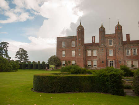 outside melford hall in long melford suffolk mansion manor overcast garden hedge view; England; UKの写真素材