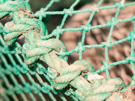 close up of fishing green netting of cage; England; Essex