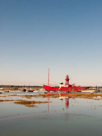 big red life boat moored in tollesbury estuary sunny day; essex; england; UKの写真素材