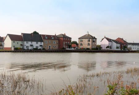 row of houses coast marina dock other side of river; Essex; England; UKのeditorial素材
