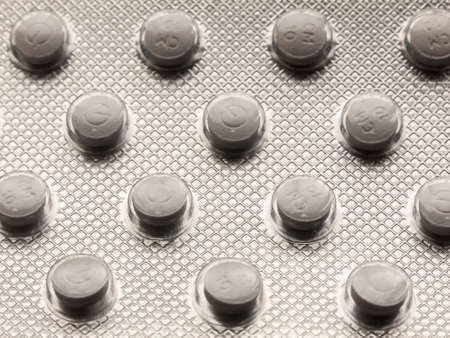 close up of back of foil tablet packet white pills; essex; england; ukの写真素材