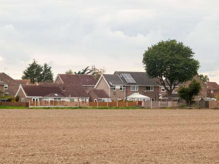 farm field ploughed autumn dead houses village; essex; england; ukの写真素材
