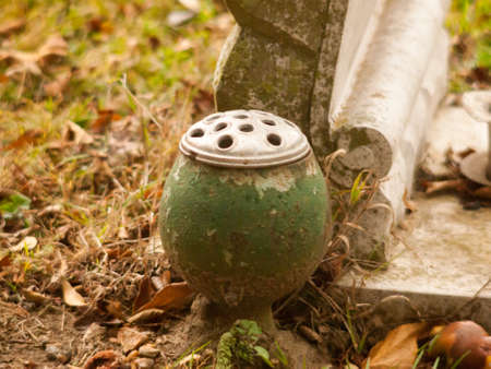 green empty round flower pot up close cemetery; essex; england; ukの写真素材