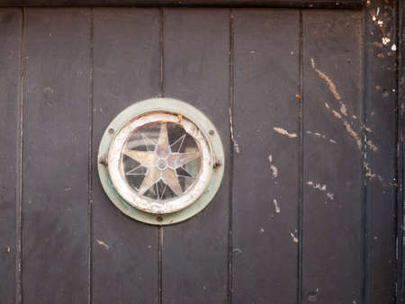 interesting star sign door window vintage rustic; essex; england; uk