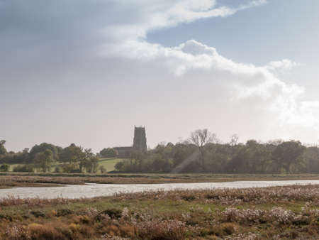 beautiful coast landscape scene with english church on horizon Alresford; essex; england; ukの写真素材