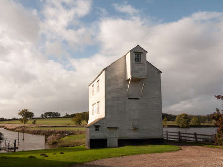 beautiful stunning white wood slat old farm water river mill house; essex; england; ukの写真素材
