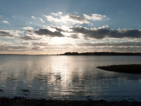 beautiful landscape open water ocean sea top surface sunset dramatic clouds; essex; england; ukの写真素材