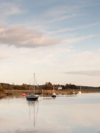boats in harbour masts landscape river lake water surface clear; essex; england; ukの写真素材