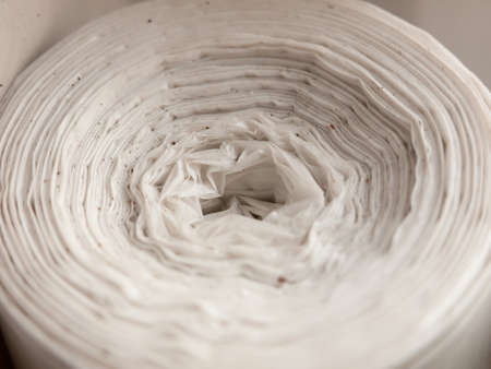 close up of twist spiral top of white bags rolled; essex; england; ukの写真素材