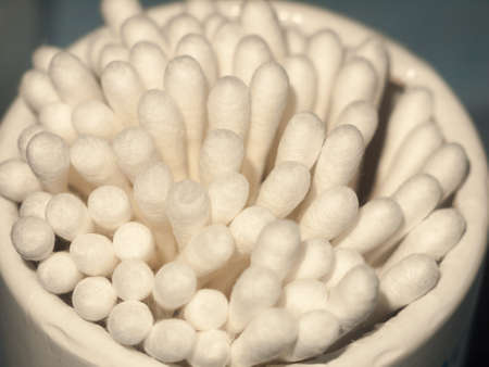 close up macro of white cotton wool ear buds q tip ends; essex; england; uk