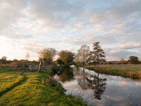 beautiful river stour lake autumn trees reflection countryside; essex; england; uk