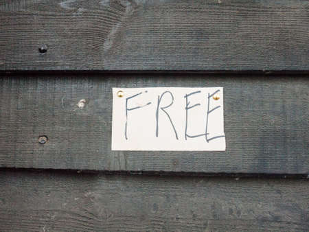 handmade pinned down white and black sign free handwriting letter; essex; england; ukの写真素材