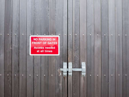No parking in front of gates access needed at all times red parking signの写真素材