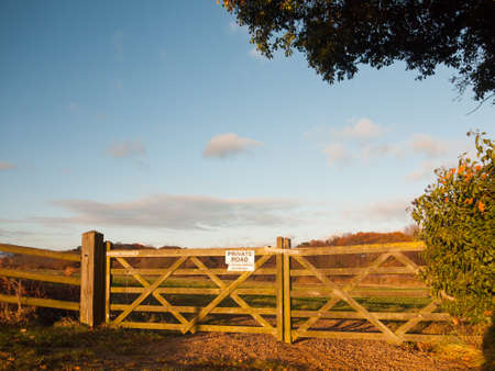 farmland countryside path trail track farm fence sign private road wood; essex; england; ukの写真素材