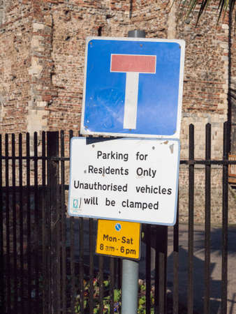 road sign parking for residents only unauthorised vehicles will be clamped; essex; england; ukのeditorial素材