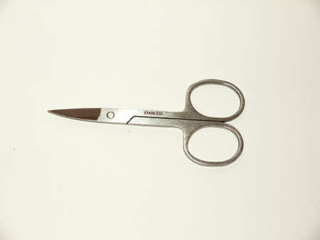 pair of silver closed nail scissors sharp white background studio; essex; england; ukの写真素材