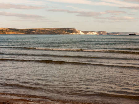 Weymouth beach dorset waves ocean water cliff tops white landscape open space beach; Dorset; England; UKの写真素材