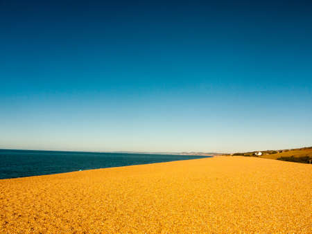 chesil beach landscape open blue sand nature view space dorset holiday; Dorset; England; UKの写真素材