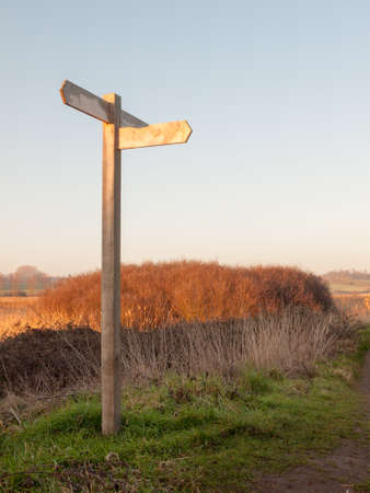 wooden countryside walking way sign directions nature; essex; england; uk