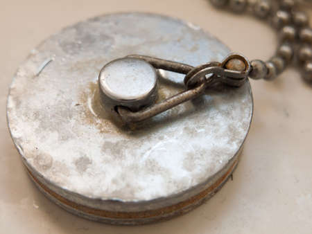 close up of bath plug rusty grimy old used dirty metal; essex; england; ukの写真素材