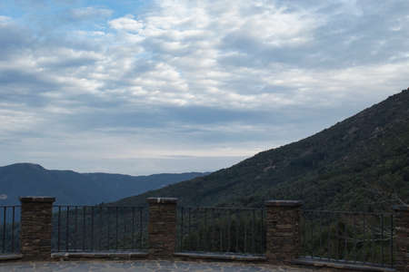 views of a cloudy sky from a stone vantage point in heightの写真素材