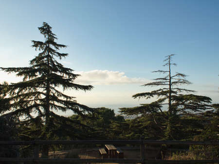 picnic area in a mountain park with the city and the sky in the background