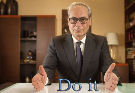 businessman with open arms looking confidently in front over the text do itの写真素材