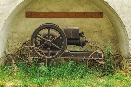 Old steam machine staying in a backyardの写真素材