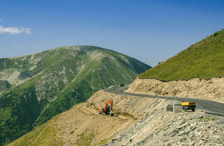 Road on top of mountains under constructionの写真素材