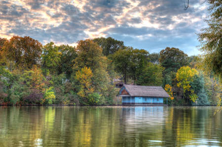 Peaceful lake view with old cabin on Herastrau lake in Bucharest, Romaniaのeditorial素材